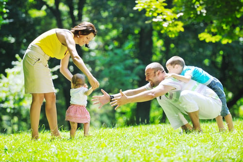 A family playing at a park in Washington.