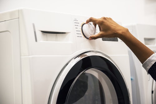 Moving a washing machine.