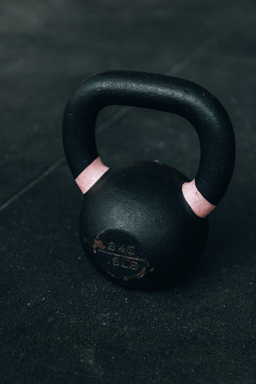 Moving gym dumb bells.